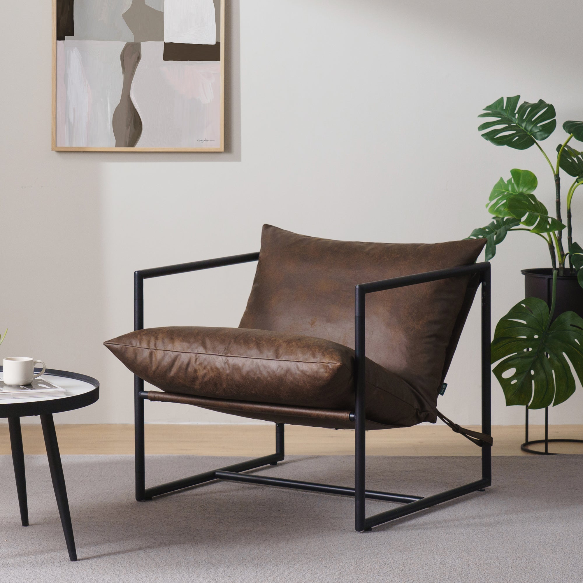 Amazon_ZINUSAidanFauxLeatherSlingAccentChair_CocoaBrown_-10.jpg